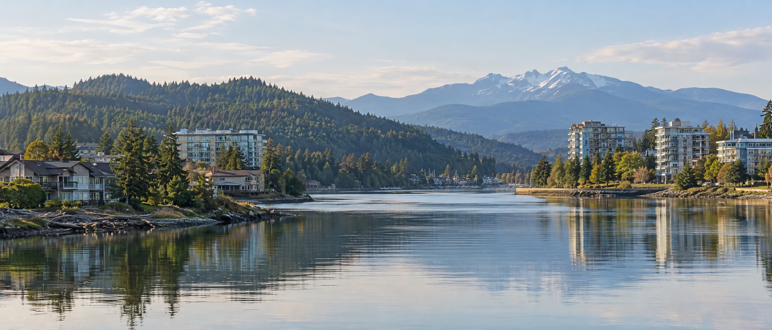 Long exposure of an inlet at blue hour with waterfront buildings reflected in still water